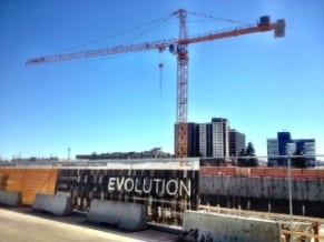 Evolution condos construction crane East Village Calgary